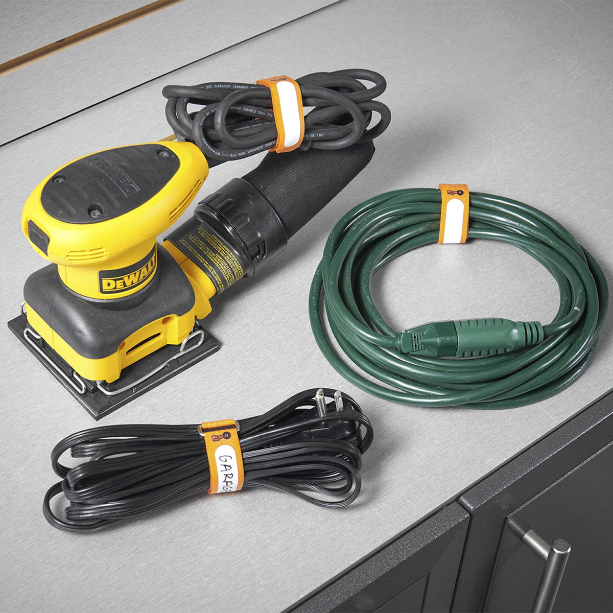 Wrap-It Storage cinch strap with label tab helps organize cords and cables.