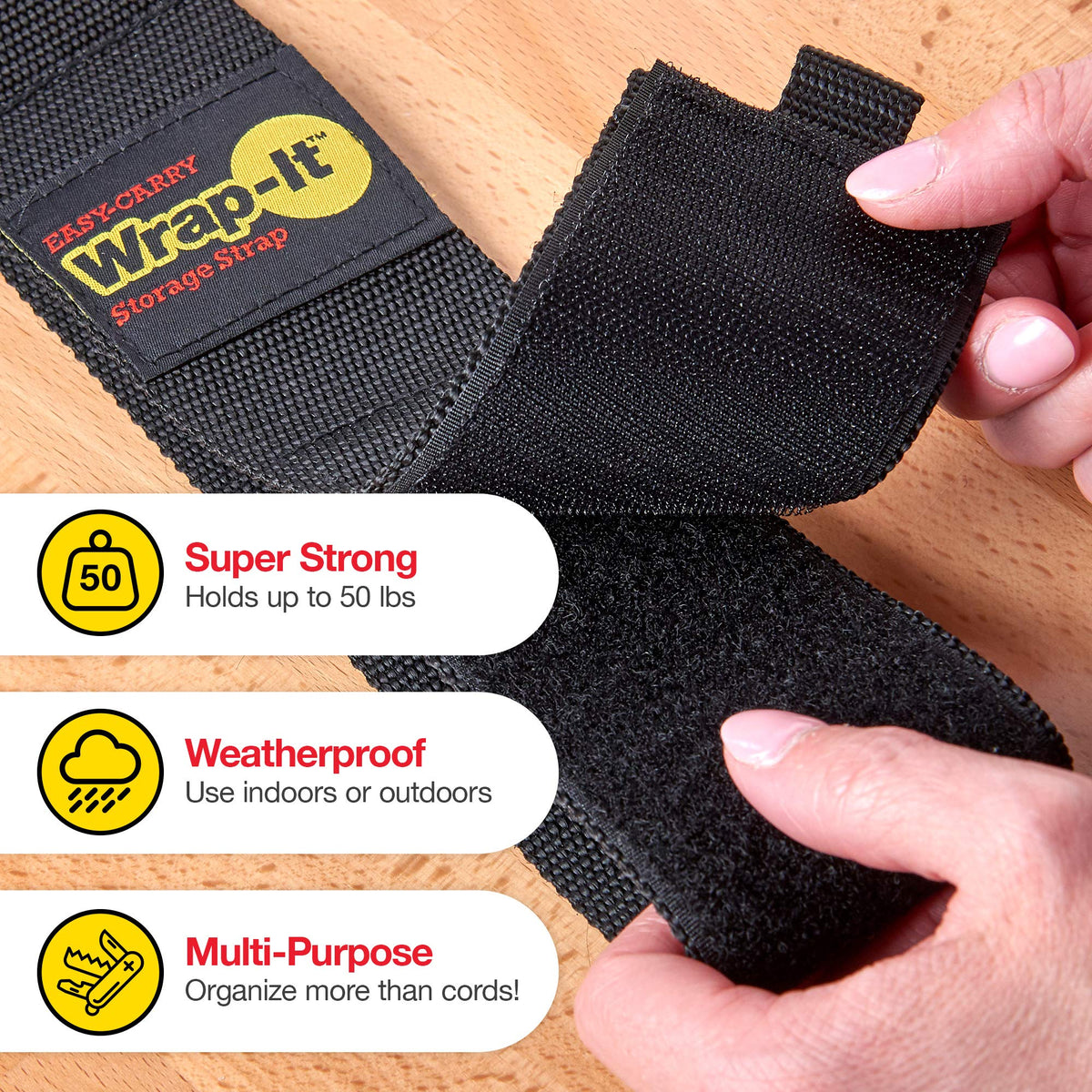 Wrap-It Storage easy-carry loop held by hand showing comfortable transport of large coils benefit