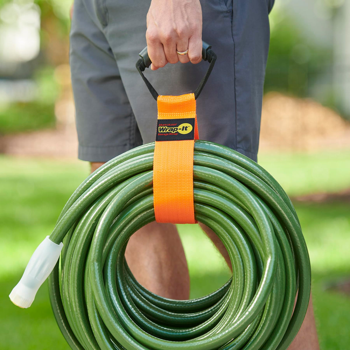 Wrap-It Storage Easy-Carry strap hangs in a garage for cord management.