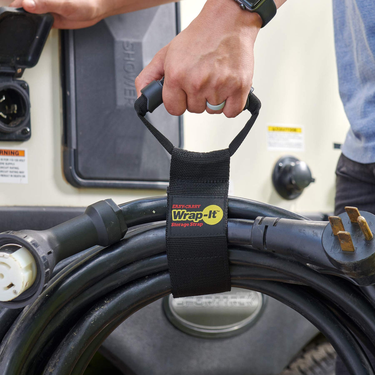 Wrap-It Storage neatly coiled extension cords secured by straps for quick access benefit