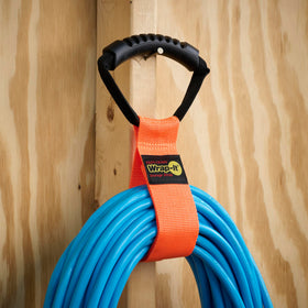 Garage organization with Wrap-It Storage 17-inch orange strap.