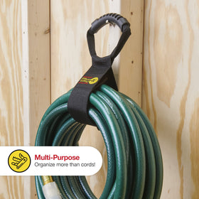 Wrap-It Storage strap around garden hose for tidy yard storage.