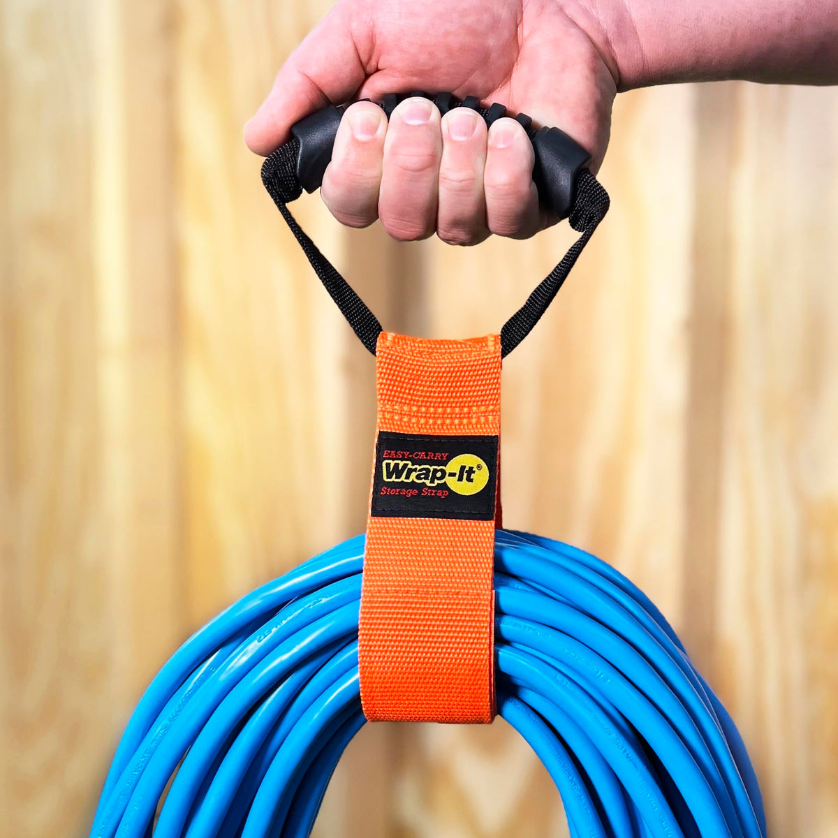 Handle-equipped Wrap-It Storage strap for carrying and hanging gear.