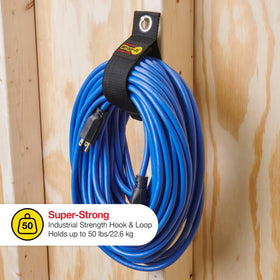 Wrap-It Storage holding RV hose on wall demonstrating space-saving travel benefit