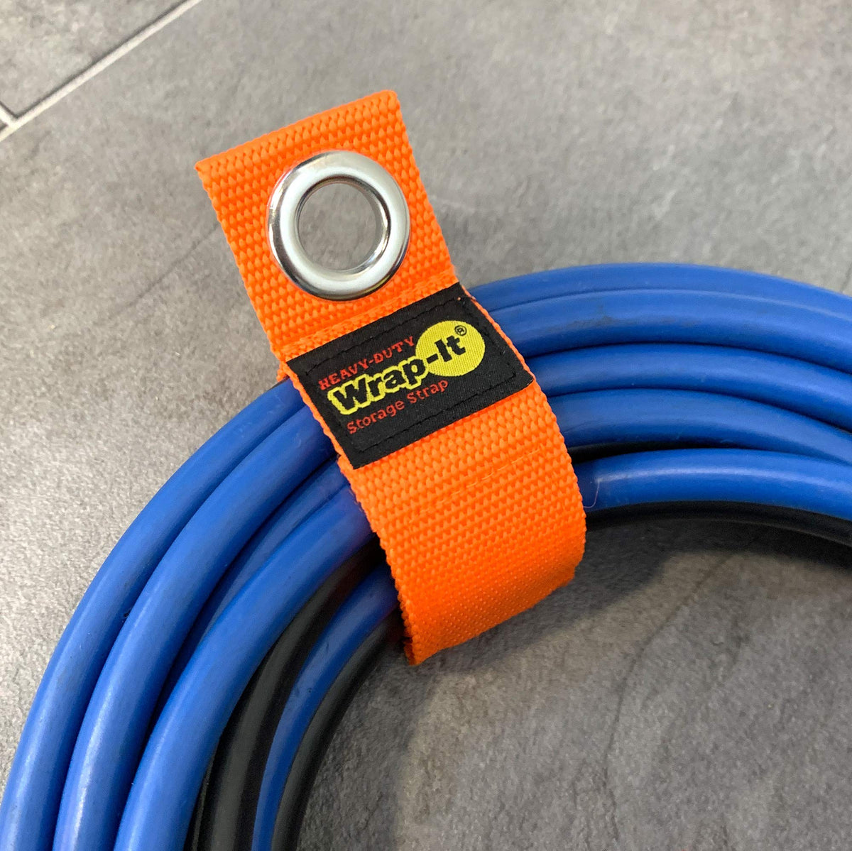 Wrap-It Storage hose storage orange keeps hoses neatly stored and accessible.