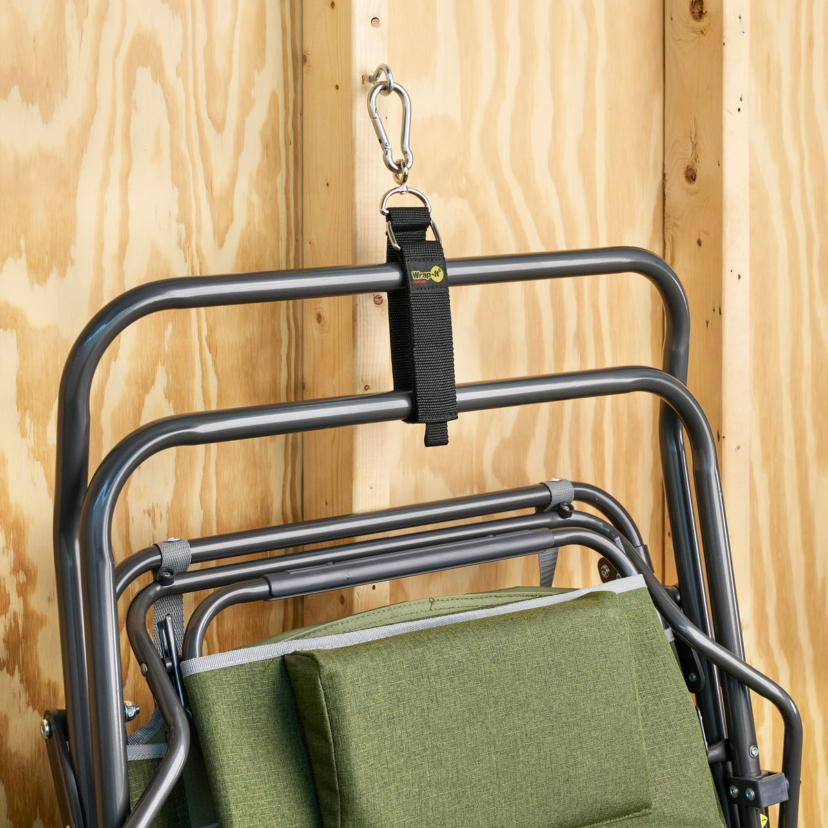 Wrap-It Storage holding a coiled extension cord on a garage peg, clearing floor space