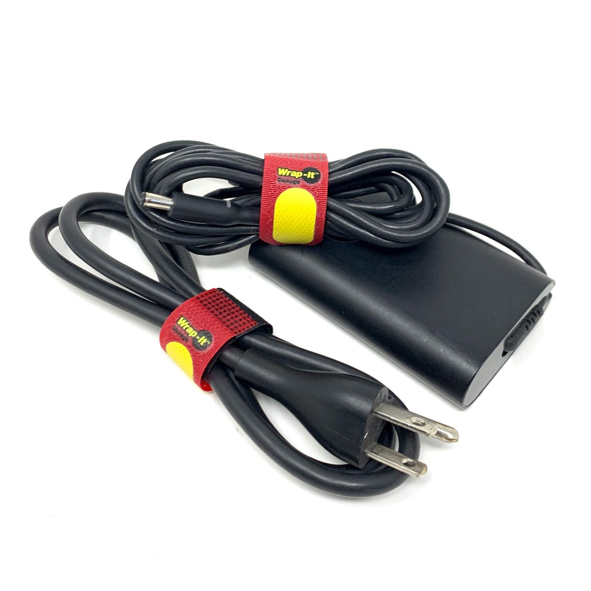 Wrap-It Storage in home office wrapping monitor and power cords for tidy workspace