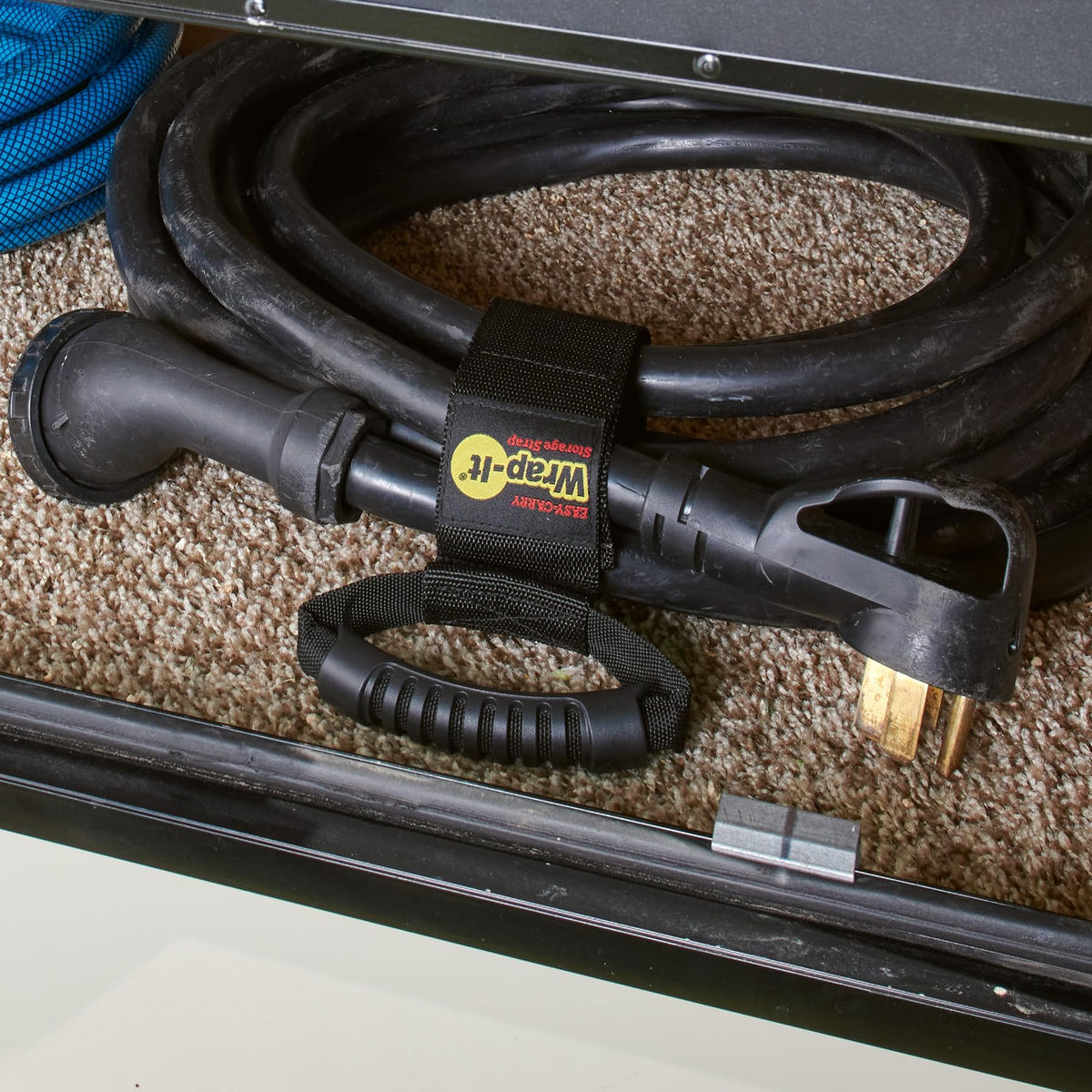 Wrap-It Storage keeps cords neat in a cluttered garage.