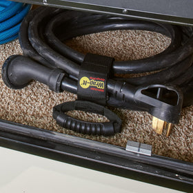 Wrap-It Storage keeps cords neat in a cluttered garage.