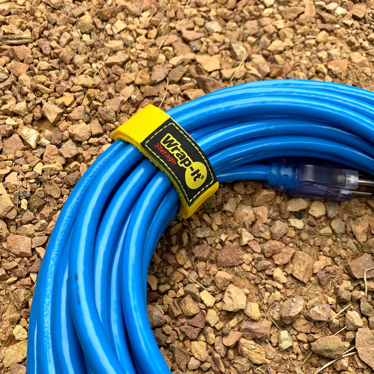 Wrap-It Storage Quick-Straps organized workshop cables for easy access.