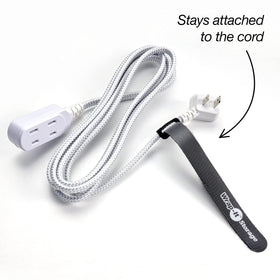 Wrap-It Storage 8-inch black self-gripping tie securing desk cables neatly.