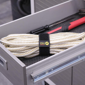 Yellow attachment tab showing how to secure a cord with Selfie Straps