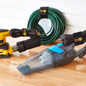 Wrap-It Storage Super-Stretch 9-inch strap secures hoses for organized shed storage.