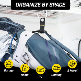 Wrap-It Storage strap in a busy workshop keeps cables accessible.