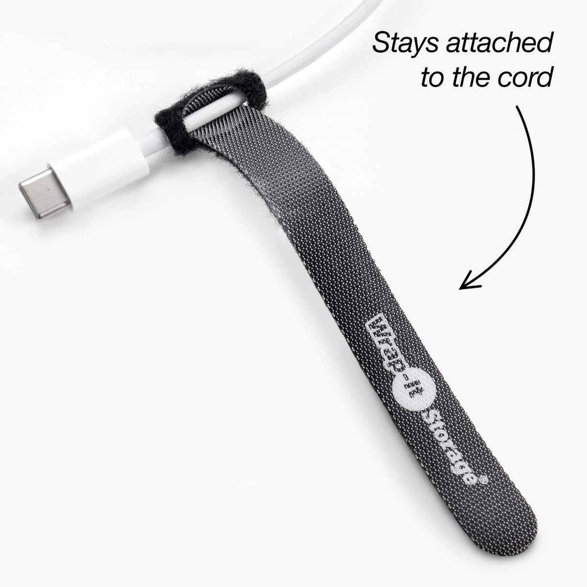 Wrap-It Storage securing charging cables on desk for tidy workspace benefit