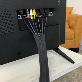 Under-desk installation of Wrap-It Storage zipper cable sleeve concealing cables