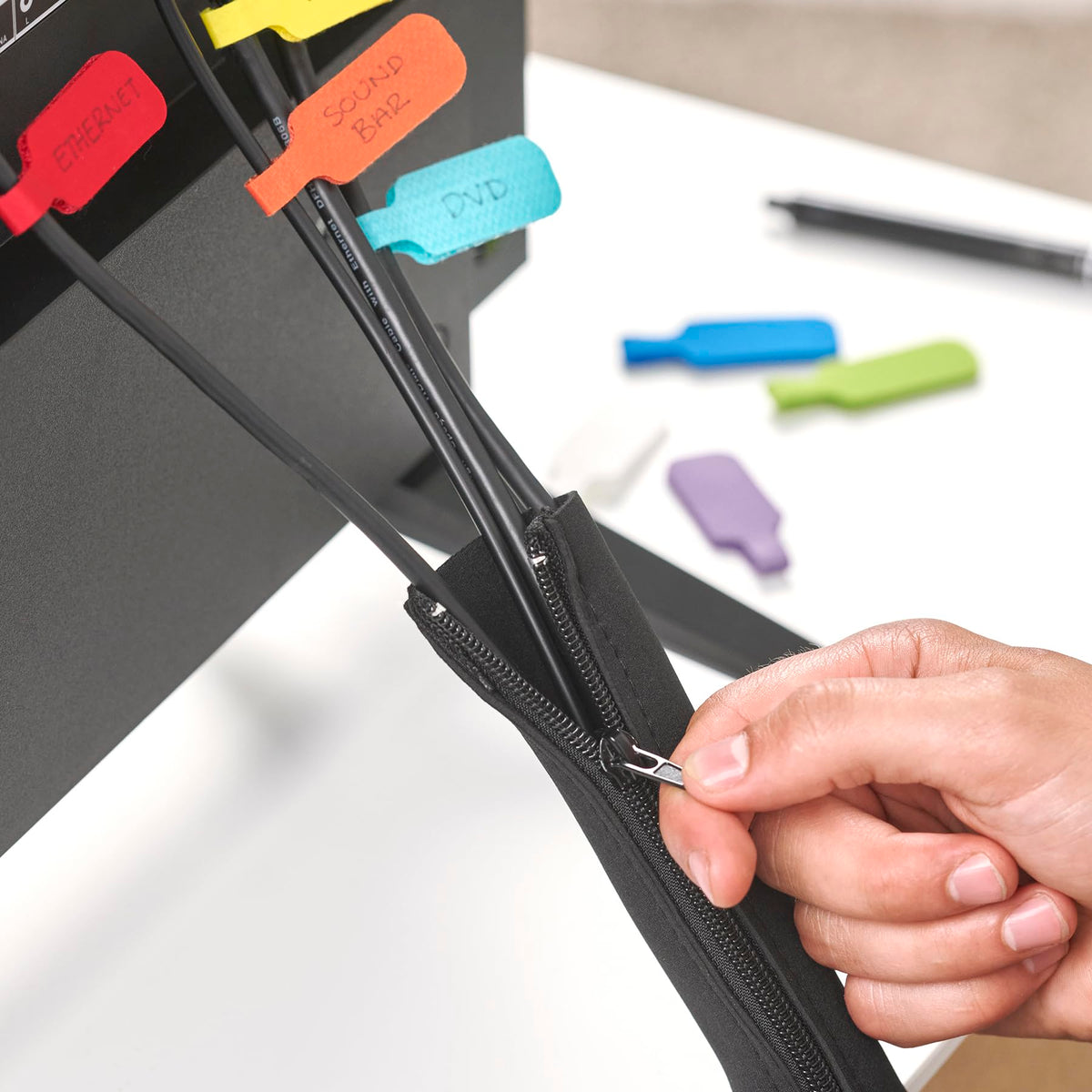 Wrap-It Storage zipper cable sleeve desk organization keeps power and data cables tidy.