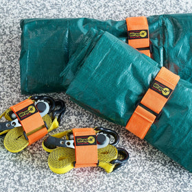 Wrap-It Straps securing a garden hose for neat storage.