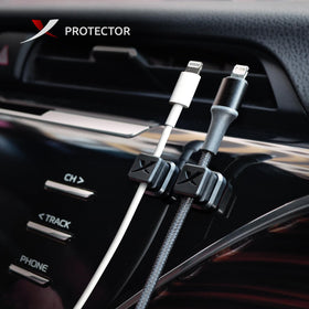 X-Protector cord holder on a wall keeps cords within reach and tidy.