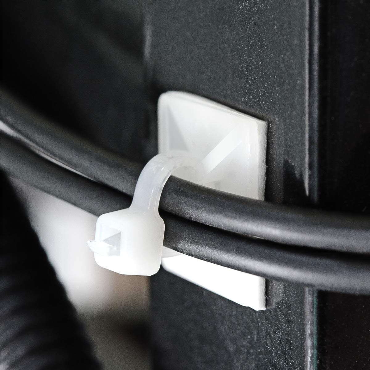XHF close-up of PA66 mount texture and adhesive backing for durability