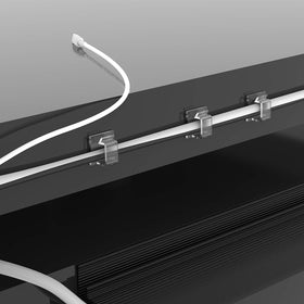 XIAOXI clip beside a coin showing compact size and easy placement benefit