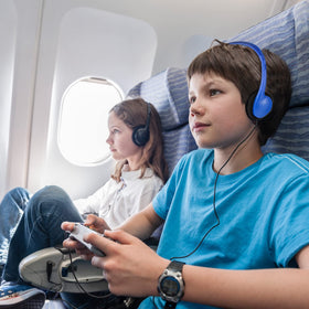 XOSDA headset in use by student at a classroom computer demonstrating dependable learning use