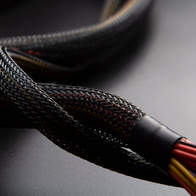 Xuniea protective cable sleeves in use guarding cables from pets and wear.