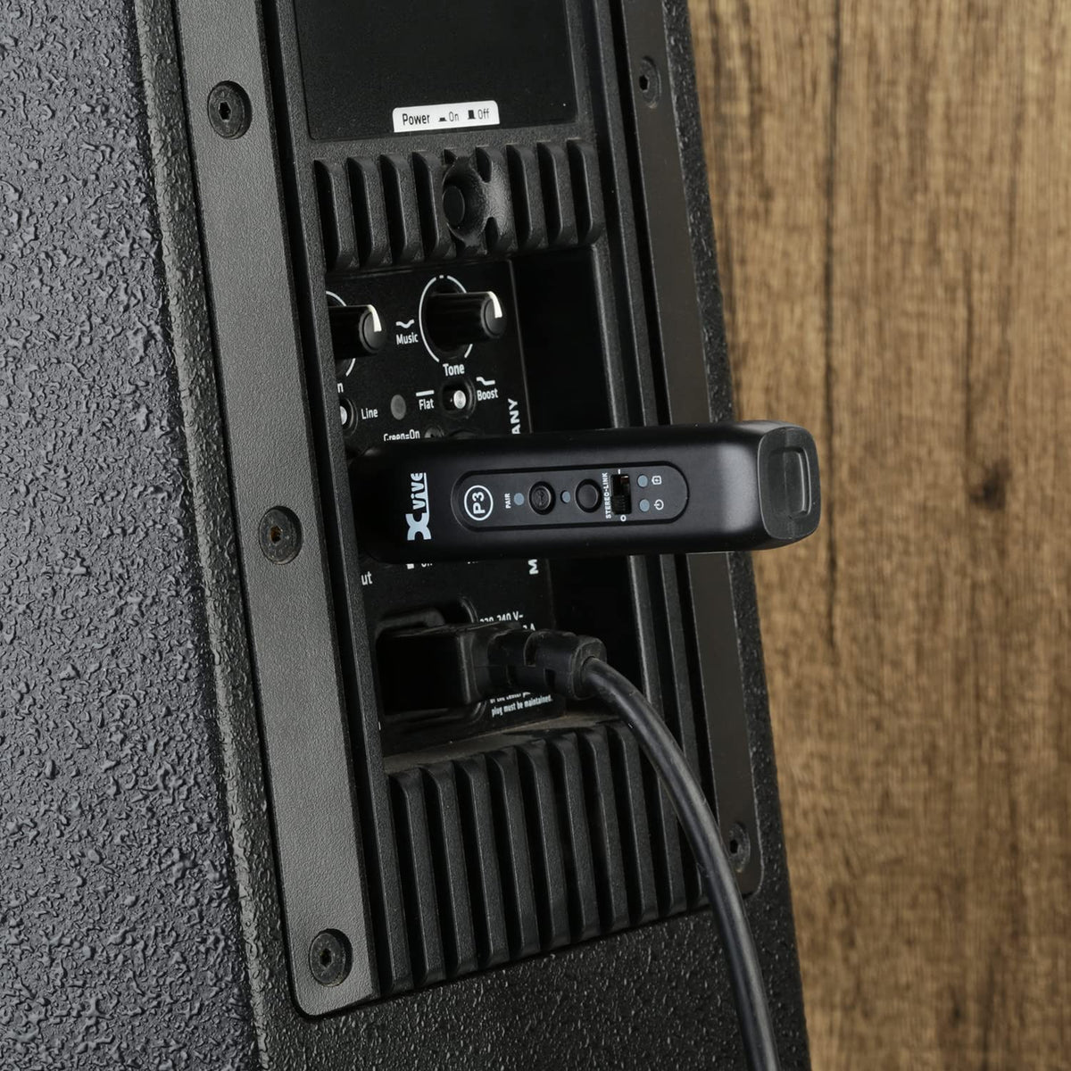 Xvive P3 used on stage with DJ gear showing wireless playback benefit