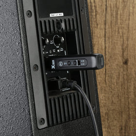 Xvive P3 used on stage with DJ gear showing wireless playback benefit