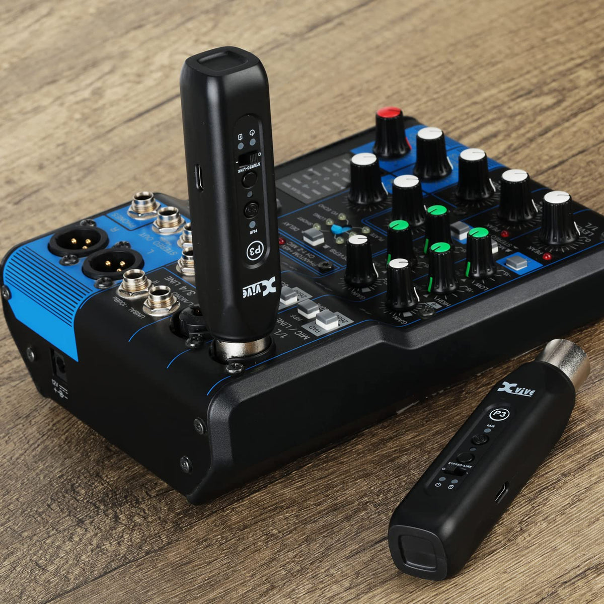 Xvive P3 beside a smartphone showing scale and easy portability