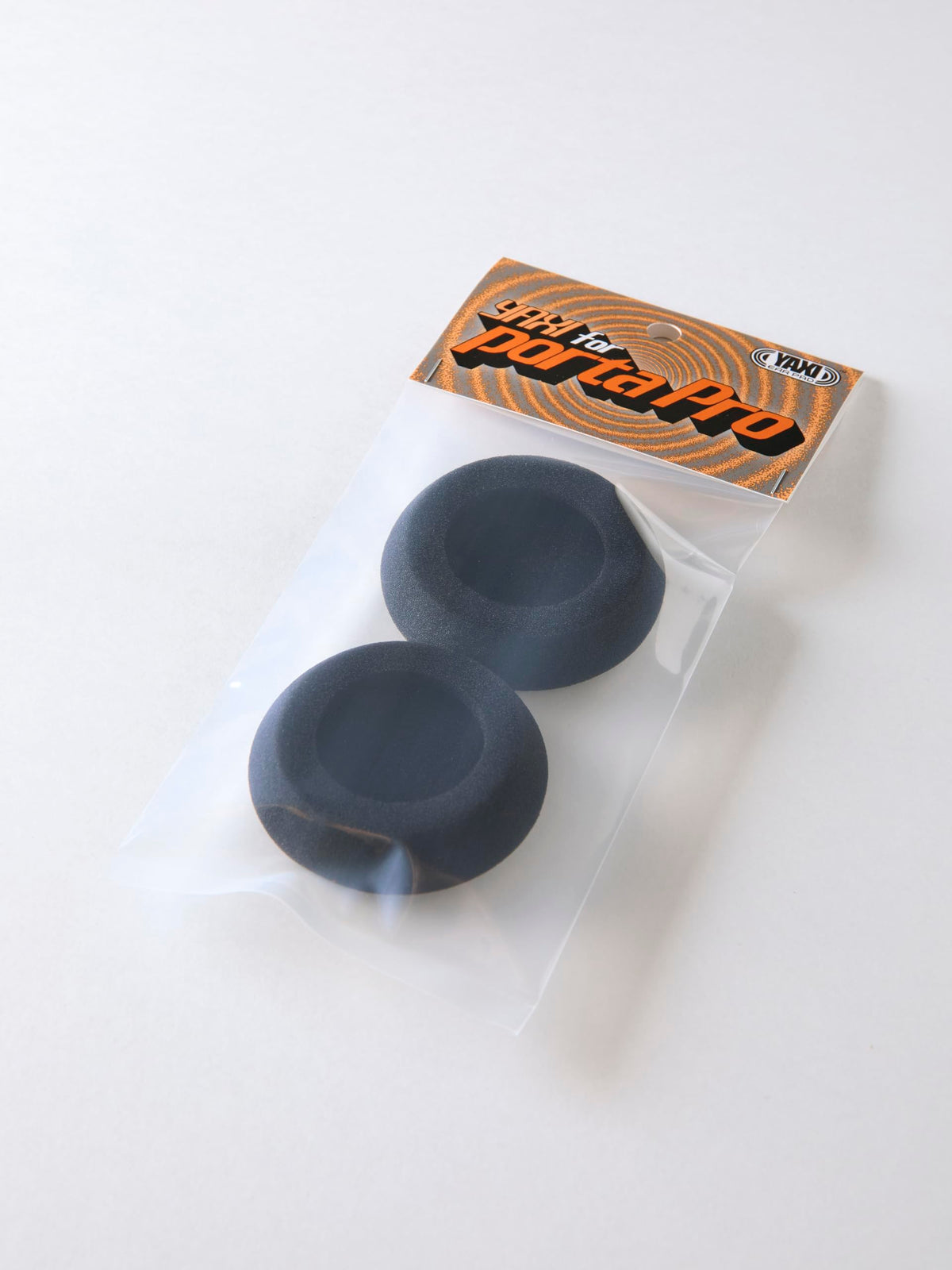 YAXI Porta Pro black ear pads in use demonstrating secure fit and extended wear.