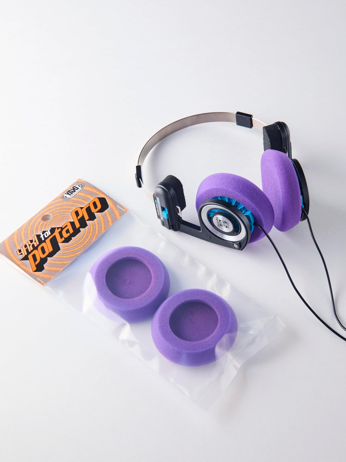 YAXI Porta Pro ear pads purple side view emphasizing thicker cushioning.