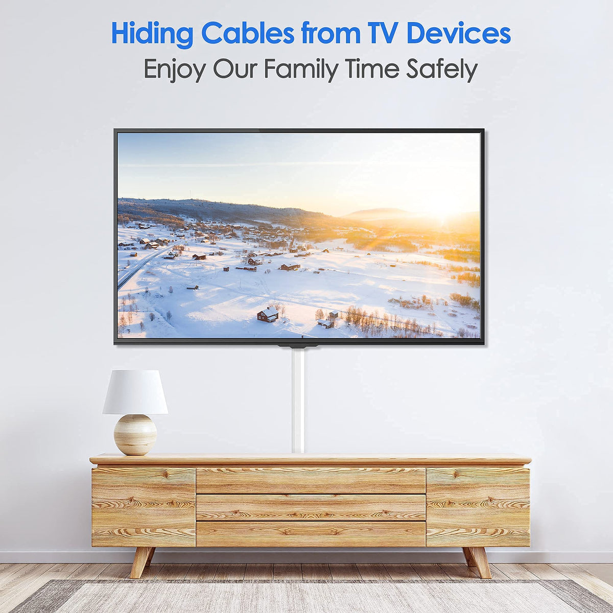 Yecaye Cord Hider hides two cables at a time behind a wall mounted TV.