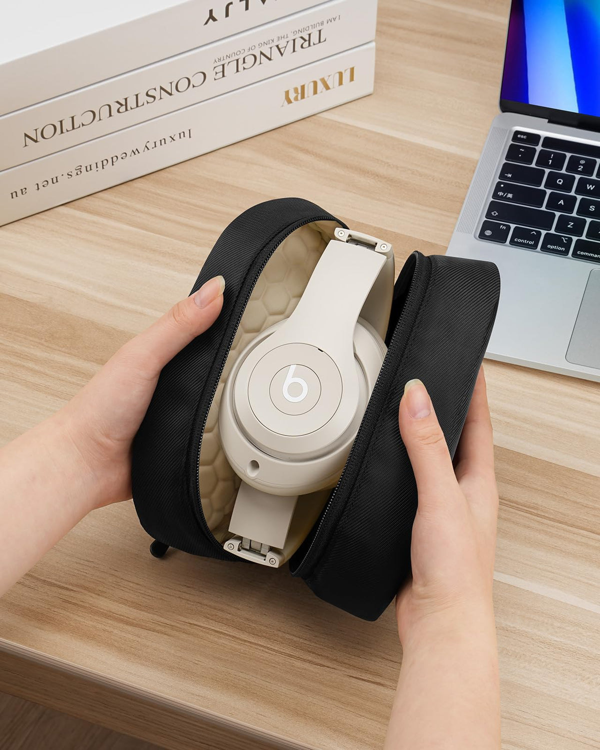 YINKECASE four layer padding protects headphones during transport.