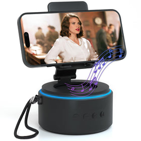 ZAPUVO Bluetooth speaker with phone stand on desk for hands-free viewing.