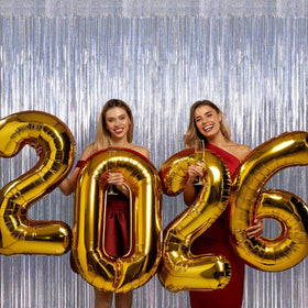 ZATAYE silver fringe backdrop installs quickly with adhesive tape.