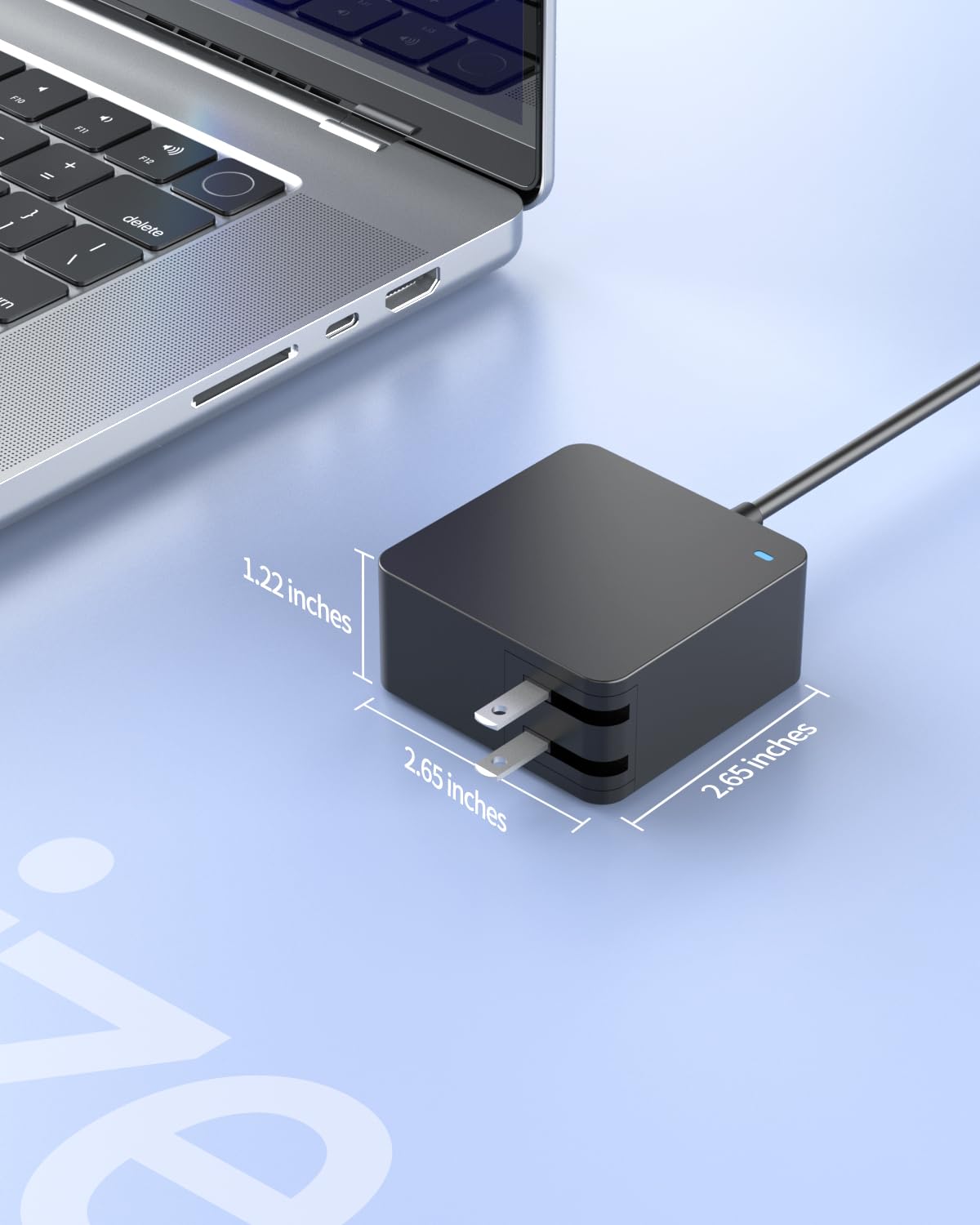 Zouxan charger in travel setup powering a laptop